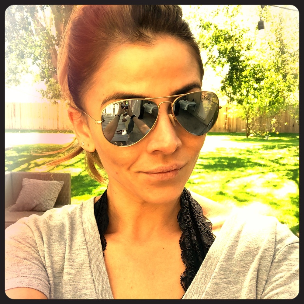 Ray-Bans mirrored lenses.